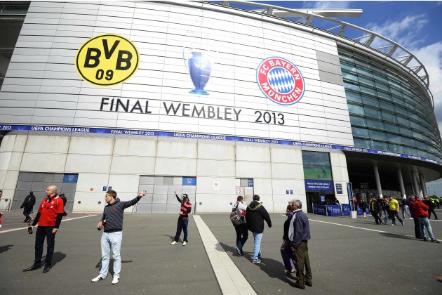 Fans pose for photographs before the Borussia Dortmund versus Bayern Munich Champions League Final soccer match at Wembley Stadium in London