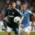 Manchester City's Aleksandar Kolarov challenges Real Madrid's Karim Benzema during their Champions League Group D soccer match at The Etihad Stadium in Manchester