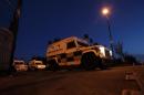 Police land rovers are seen in Belfast, Northern Ireland, on September 4, 2012