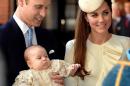 Britain's Prince William, Duke of Cambridge and his wife Catherine, Duchess of Cambridge, arrive with their son Prince George of Cambridge at Chapel Royal in St James's Palace in central London on October 23, 2013