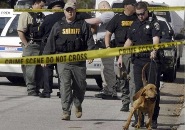 Authorities investigate the scene of shooting in Brunswick, Ga. on Thursday, March 21, 2013. A young boy opened fire on a woman pushing her baby in a stroller in a Georgia neighborhood, killing the 1-year-old boy and wounding the mother, police said. The woman, Sherry West, told WAWS-TV that two boys approached her and demanded money Thursday morning. Brunswick Police Chief Tobe Green said the boys are thought to be between 10 and 15 years old.(AP Photo/The Morning News, Terry Dickson)