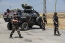 Turkish soldiers guard a check point in the troubled southeast of the country