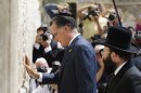 Republican presidential candidate and former Massachusetts Gov. Mitt Romney pauses next to the Western Wall, in Jerusalem, Sunday, July 29, 2012. (AP Photo/Dan Balilty)