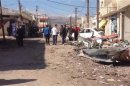 SANA photo shows a damaged area pictured after a car bomb in Qatana, near Damascus