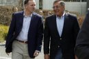 U.S. Defense Secretary Leon Panetta and New Zealand's Prime Minister John Key walk to a meeting in Auckland