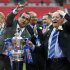 Wigan Athletic's chairman Dave Whelan, right, and manager Roberto Martinez celebrate with the trophy after their win against Manchester City at the end of their English FA Cup final soccer match at Wembley Stadium, London, Saturday, May 11, 2013. (AP Photo/Matt Dunham)