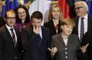 German Chancellor Merkel chats with Italian Prime Minister Renzi during family photo before German-Italian government consultations in Berlin