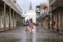 Shelly Ackel of New Orleans carries an American flag through the French Quarter as Hurricane Isaac approaches New Orleans