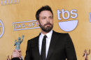 Actor Ben Affleck poses backstage with the award for best cast in a motion picture for "Argo" at the 19th Annual Screen Actors Guild Awards at the Shrine Auditorium in Los Angeles on Sunday Jan. 27, 2013. (Photo by Chris Pizzello/Invision/AP)