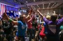 In a Saturday, May 14, 2016 photo, supporters of Democratic presidential candidate Bernie Sanders react during the Nevada State Democratic Party's 2016 State Convention at the Paris hotel-casino in Las Vegas. The Nevada Democratic Convention turned into an unruly and unpredictable event, after tension with organizers led to some Bernie Sanders supporters throwing chairs and to security clearing the room, organizers said. (Chase Stevens/Las Vegas Review-Journal via AP) LOCAL TELEVISION OUT; LOCAL INTERNET OUT; LAS VEGAS SUN OUT