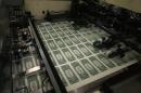 Sheets of one dollar bills run through the printing press at the Bureau of Engraving and Printing on March 24, 2015 in Washington, DC