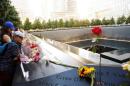 FILE PHOTO: Visitors look out over the National September 11 Memorial and Museum on the 15th anniversary of the 9/11 attacks in New York