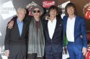 The Rolling Stones pose as they arrive for the opening of the exhibition "Rolling Stones: 50" at Somerset House in London