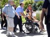 Samantha Yowler is pushed in a wheelchair into the University of Colorado Hospital to meet with President Barack Obama in Aurora
