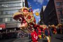 Dragon dancers cross Canal Street during the Chinatown Lunar New Year parade on February 17, 2013 in New York City