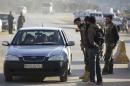 Islamist fighters man a checkpoint at the Syrian border crossing of Bab al-Hawa