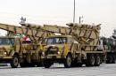 Iranian trucks carrying Zelzal missiles take part in a 2014 military parade in Tehran