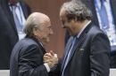 FILE - In this Friday, May 29, 2015 file photo, FIFA president Sepp Blatter after his election as President greeted by UEFA President Michel Platini, right, at the Hallenstadion in Zurich, Switzerland. Blatter has been re-elected as FIFA president for a fifth term, chosen to lead world soccer despite separate U.S. and Swiss criminal investigations into corruption. The 209 FIFA member federations gave the 79-year-old Blatter another four-year term on Friday after Prince Ali bin al-Hussein of Jordan conceded defeat after losing 133-73 in the first round. (Patrick B. Kraemer/Keystone via AP, File)