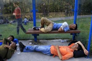 Migrants sleep at a bus stop after crossing into Hungary&nbsp;&hellip;