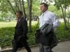 Former Major League Baseball pitcher Roger Clemens, right, arrives at federal court in Washington, Wednesday, May 23, 2012.  (AP Photo/Manuel Balce Ceneta)