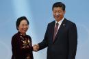 Vietnam's Vice President Nguyen Thi Doan and China's President Xi Jinping shake hands before the opening ceremony of the CICA summit in Shanghai