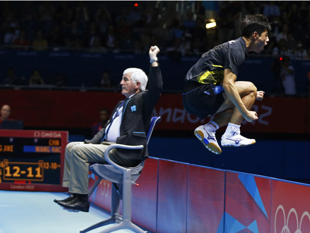 China's Zhang Jike celebrates after defeating China's Wang Hao in their men's singles gold medal table tennis match at the ExCel venue during the London 2012 Olympic Games