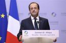 France's President Hollande speaks at a joint news conference with Germany's Chancellor Merkel during a European Union-Africa summit in Brussels