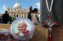 A picture of the late Pope John Paul II is seen on a rosary, for sale in Saint Peter's Square
