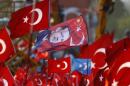A flag with the picture of Turkey's President Erdogan is seen during the Democracy and Martyrs Rally in Istanbul