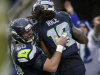 Seattle Seahawks' Sidney Rice (18) celebrates his touchdown with teammate Max Unger (60) during the second half of an NFL football game against the New York Jets, Sunday, Nov. 11, 2012, in Seattle. (AP Photo/Elaine Thompson)