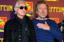 FILE - In this Oct. 9, 2012 file photo, Led Zeppelin guitarist Jimmy Page, left, and singer Robert Plant appear at a press conference ahead of the worldwide theatrical release of "Celebration Day," a concert film of their 2007 London O2 arena reunion show, in New York. Led Zeppelin's lawyers asked a judge Monday, June 20, 2016, to throw out a case accusing the band's songwriters of ripping off a riff for "Stairway to Heaven." (Photo by Evan Agostini/Invision/AP, File)