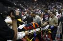 Indiana Pacers' Paul George is carted off the court after breaking his right leg during the USA Basketball Showcase intrasquad game in Las Vegas on Friday, Aug. 1, 2014. (AP Photo/Las Vegas Review-Journal, Jason Bean)