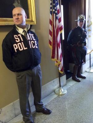 Rhode Island state police officers stand outside the&nbsp;&hellip;