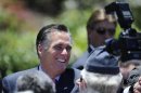 Romney, U.S Republican presidential candidate and former Massachusetts governor, shakes hands with supporters during memorial day ceremony at Veterans Museum and Memorial Center in San Diego