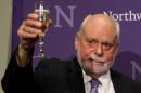 J. Fraser Stoddart, one of the winners of 2016 Nobel Prize for Chemistry, raises his glass for a toast at Northwestern University in the Chicago suburb of Evanston