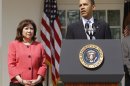 FILE - This April 15, 2010 file photo shows Labor Secretary Hilda Solis standing with President Barack Obama in the Rose Garden of the White House in Washington. Solis is telling colleagues she is leaving the Obama administration. (AP Photo/Charles Dharapak, File)