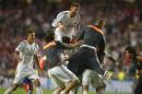 Real's Sergio Ramos , centre in air, reacts with teammates, at the end of the Champions League final soccer match between Atletico Madrid and Real Madrid, at the Luz stadium, in Lisbon, Portugal, Saturday, May 24, 2014. (AP Photo/Manu Fernandez)