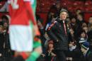 Manchester United's Dutch manager Louis van Gaal (R) leaves the field after the final whistle during the English Premier League football match between Manchester United and Southampton in Manchester, England, on January 11, 2015