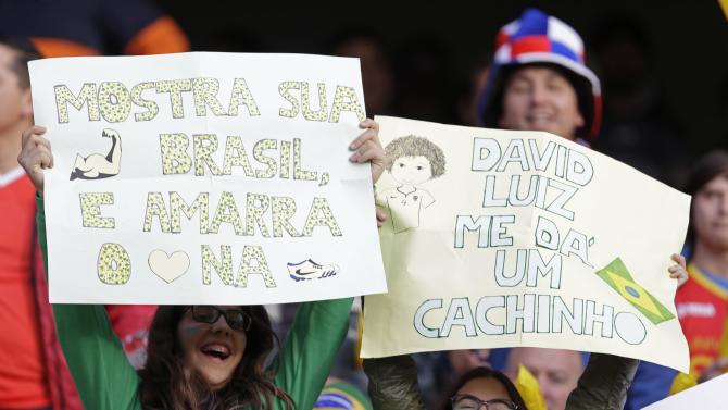 Brazil&#39;s fans hold signs in support of their players before a Copa America quarterfinal soccer match between Brazil and Paraguay at the Ester Roa Rebolledo Stadium in Concepcion, Chile, Saturday, June 27, 2015. (AP Photo/Natacha Pisarenko)