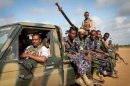 Fighters of the pro-government Ras Kimboni Brigade at the Kismayo Airport in southern Somalia on August 22, 2013