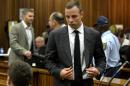 South African amputee Olympian sprinter Oscar Pistorius arrives at the High Court in Pretoria on the opening day of his murder trial on March 3, 2014