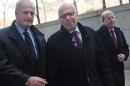 Rupert Murdoch ,center, arrives at State Supreme court, Wednesday, Nov. 20, 2013, in New York. Murdoch and his soon-to-be-ex-wife said they were parting with "mutual respect" Wednesday after telling a judge they had reached a divorce deal. (AP Photo/ Louis Lanzano)