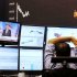 The curve of the German stock index DAX is pictured as news about the US elections appear on a television screen at the stock market in Frankfurt, Germany, Wednesday, Nov. 7, 2012. (AP Photo/Michael Probst)