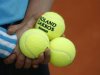 Ball boy holds tennis balls ahead of the French Open tennis tournament at the Roland Garros stadium in Paris