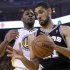 San Antonio Spurs' Duncan takes a rebound from Golden State Warriors' Ezeli during Game 6 of their NBA Western Conference semi final playoff basketball game in Oakland