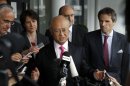 Director General of the International Atomic Energy Agency, IAEA, Yukiya Amano, center, from Japan speaks to the media after returning from Iran at the Vienna International Airport near Schwechat, Austria, on Tuesday, May 22, 2012. Amano says he has reached a deal with Iran on probing suspected work on nuclear weapons and adds that the agreement will 
