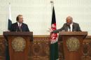 FILE - In a May 12, 2015 file photo, Afghan President Ashraf Ghani, right, speaks as Pakistani Prime Minister Nawaz Sharif listens during a joint press conference at the presidential palace in Kabul, Afghanistan. Pakistan said Wednesday, July 8, 2015, that the first official face-to-face discussions between Afghan government officials and the Taliban have made progress, with the two sides agreeing at a meeting near Islamabad to work on confidence-building measures and hold more such talks after the Muslim holy month of Ramadan. (AP Photo/Rahmat Gul, File)