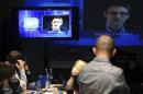 Journalists listen to a speech and question of former U.S. spy agency NSA contractor Edward Snowden at a media centre during Russian President Vladimir Putin's live broadcast nationwide phone-in in Moscow