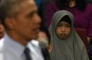 A woman looks on as US President Barack Obama takes questions from the Young Southeast Asia Leaders Initiative in Kuala Lumpur on November 20, 2015