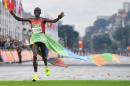 Kenya's Eliud Kipchoge celebrates after winning the men's marathon in Rio de Janeiro on August 21, 2016